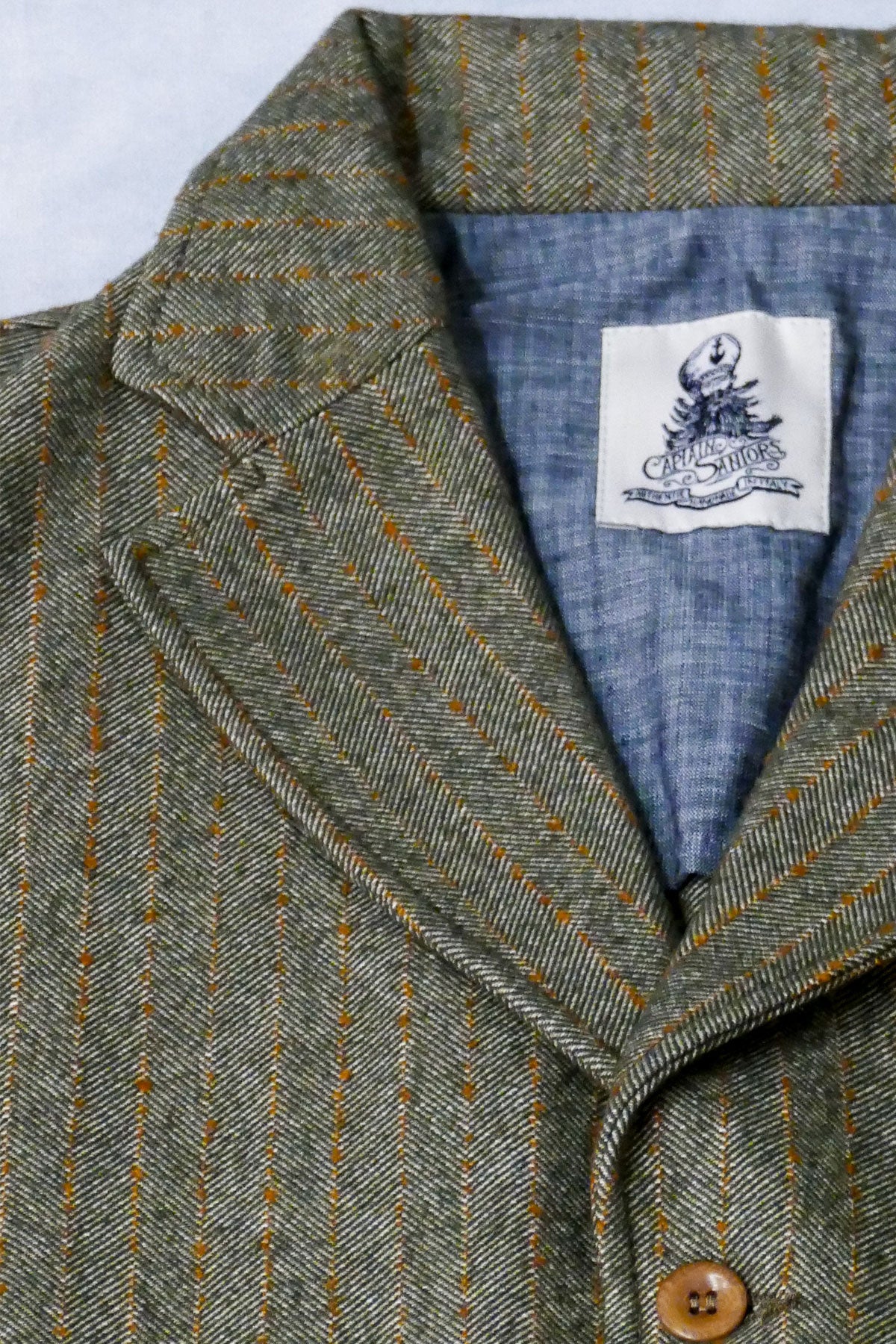 Captain Santors - Herringbone Lawyer Jacket in muted military green with rust stripes